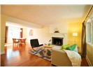 Ample oak hardwoods on main floor.  Custom fireplace, chair rail